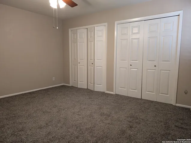a view of an empty room and closet area