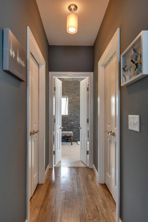 7316 Allans Ridge Lane Fairview, TN 37062 - Photo 12 of 30 a view of a hallway view with wooden floor and living room