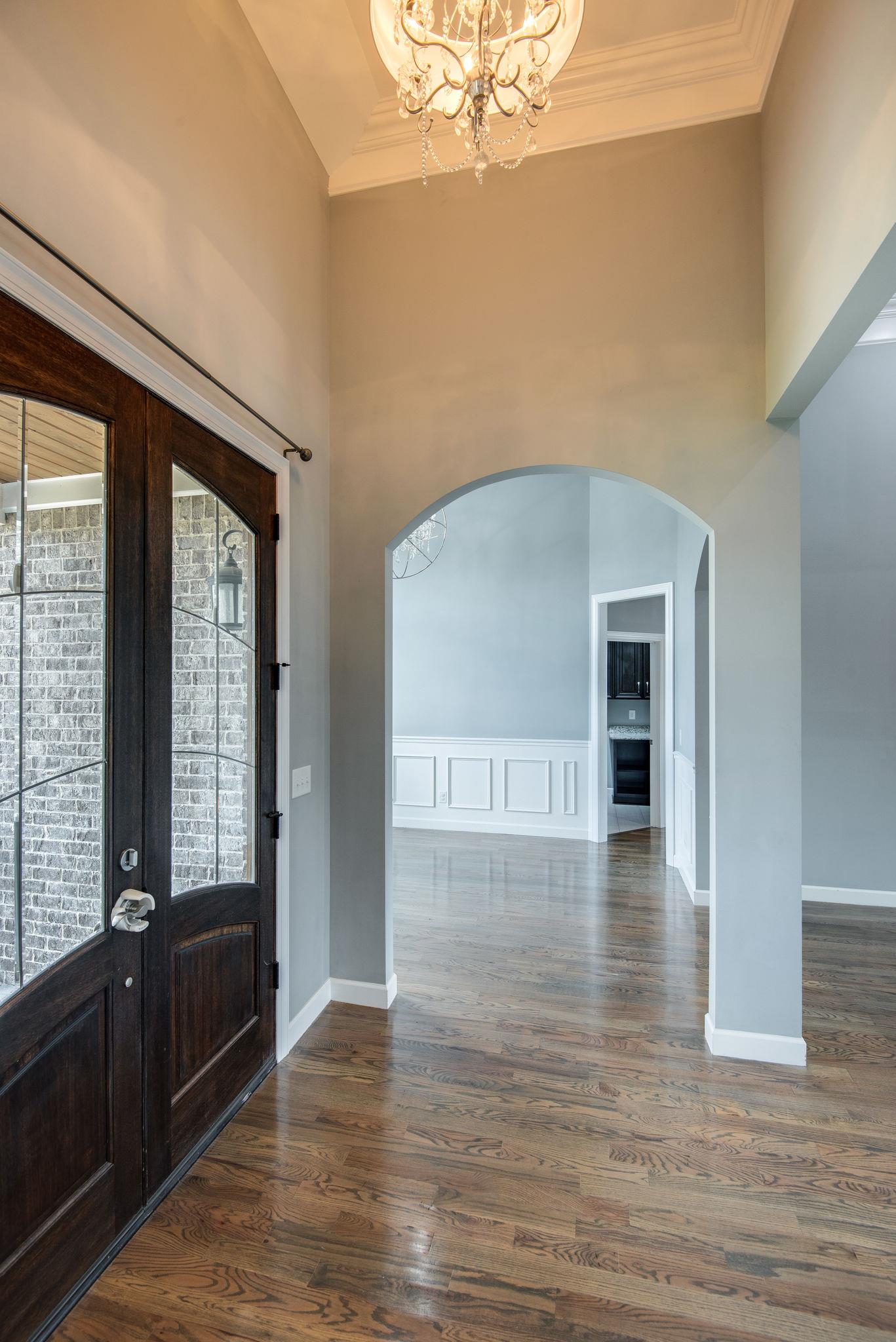 7316 Allans Ridge Lane Fairview, TN 37062 - Photo 4 of 30 a view of an empty room with wooden floor and a window