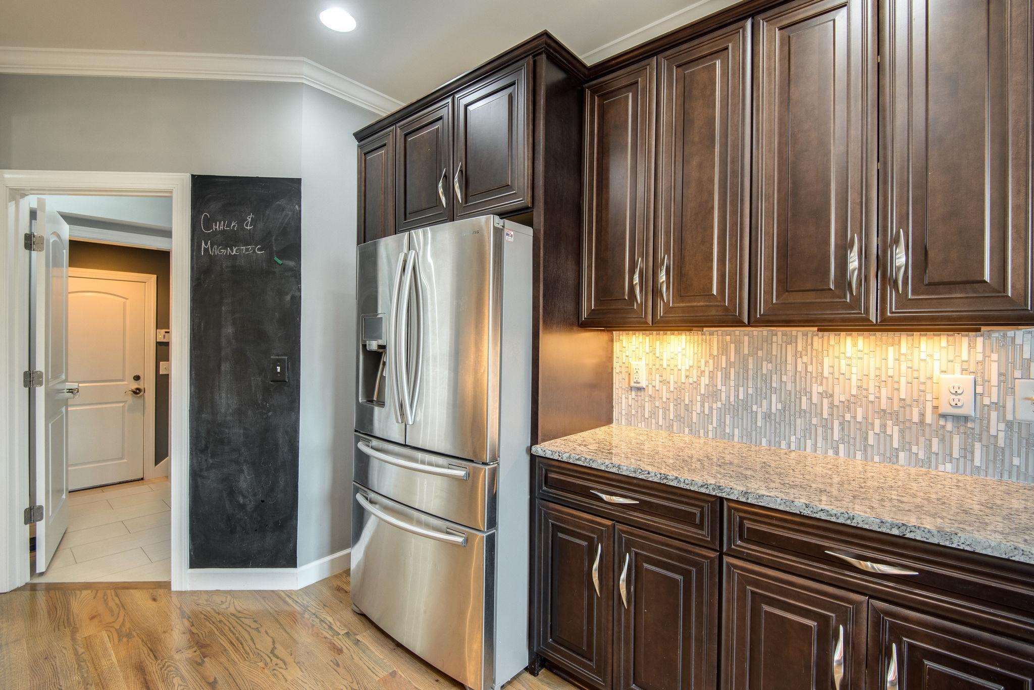 7316 Allans Ridge Lane Fairview, TN 37062 - Photo 7 of 30 a kitchen with granite countertop a refrigerator and a sink