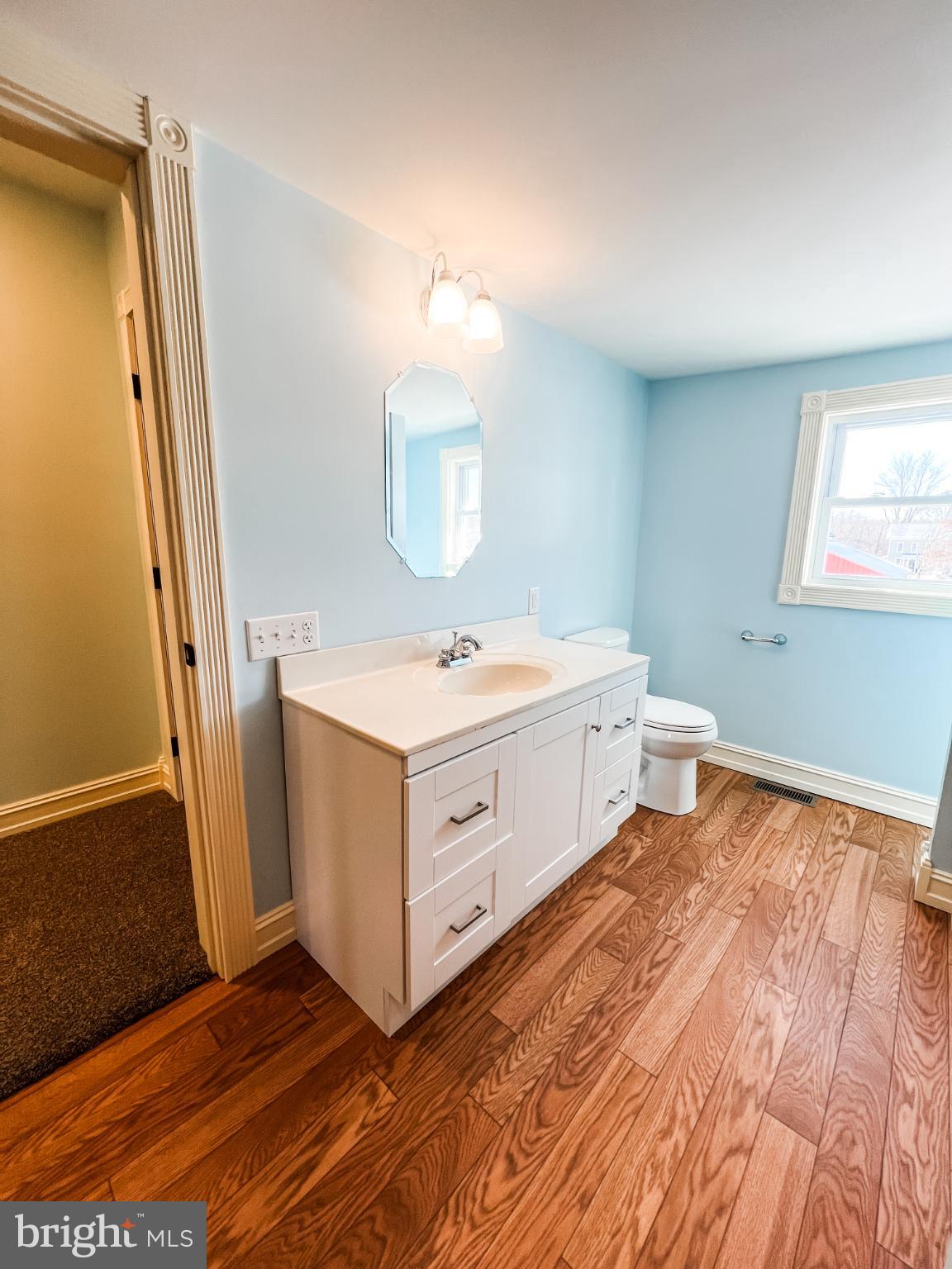 126 South Orange Street Beavertown, PA 17813 - Photo 18 of 25 a bathroom with a sink a mirror and a toilet