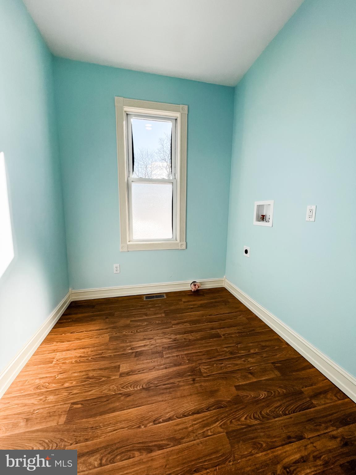 126 South Orange Street Beavertown, PA 17813 - Photo 20 of 25 a view of an empty room with wooden floor and a window
