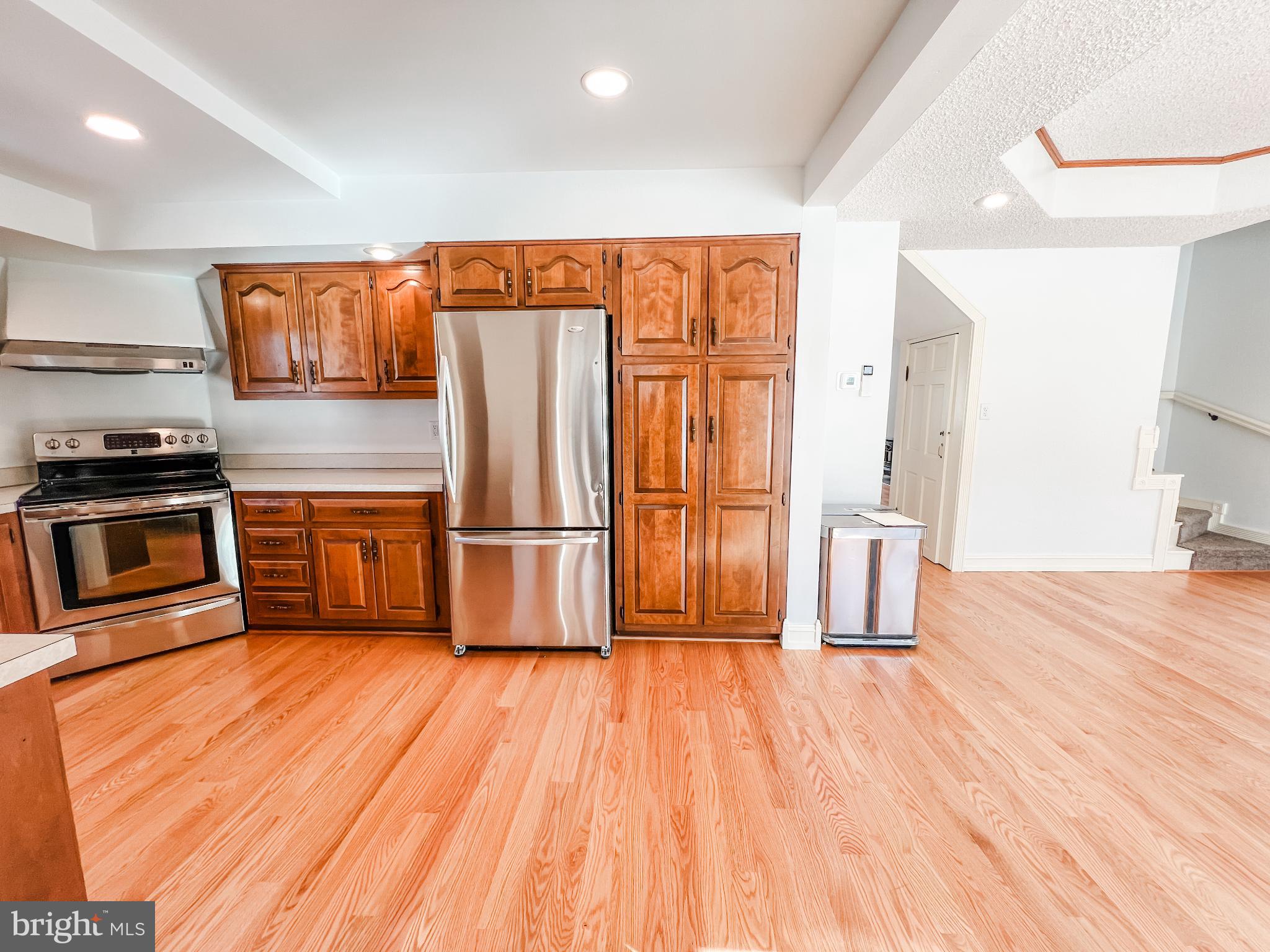 126 South Orange Street Beavertown, PA 17813 - Photo 3 of 25 a kitchen with stainless steel appliances wooden floors and wooden cabinets