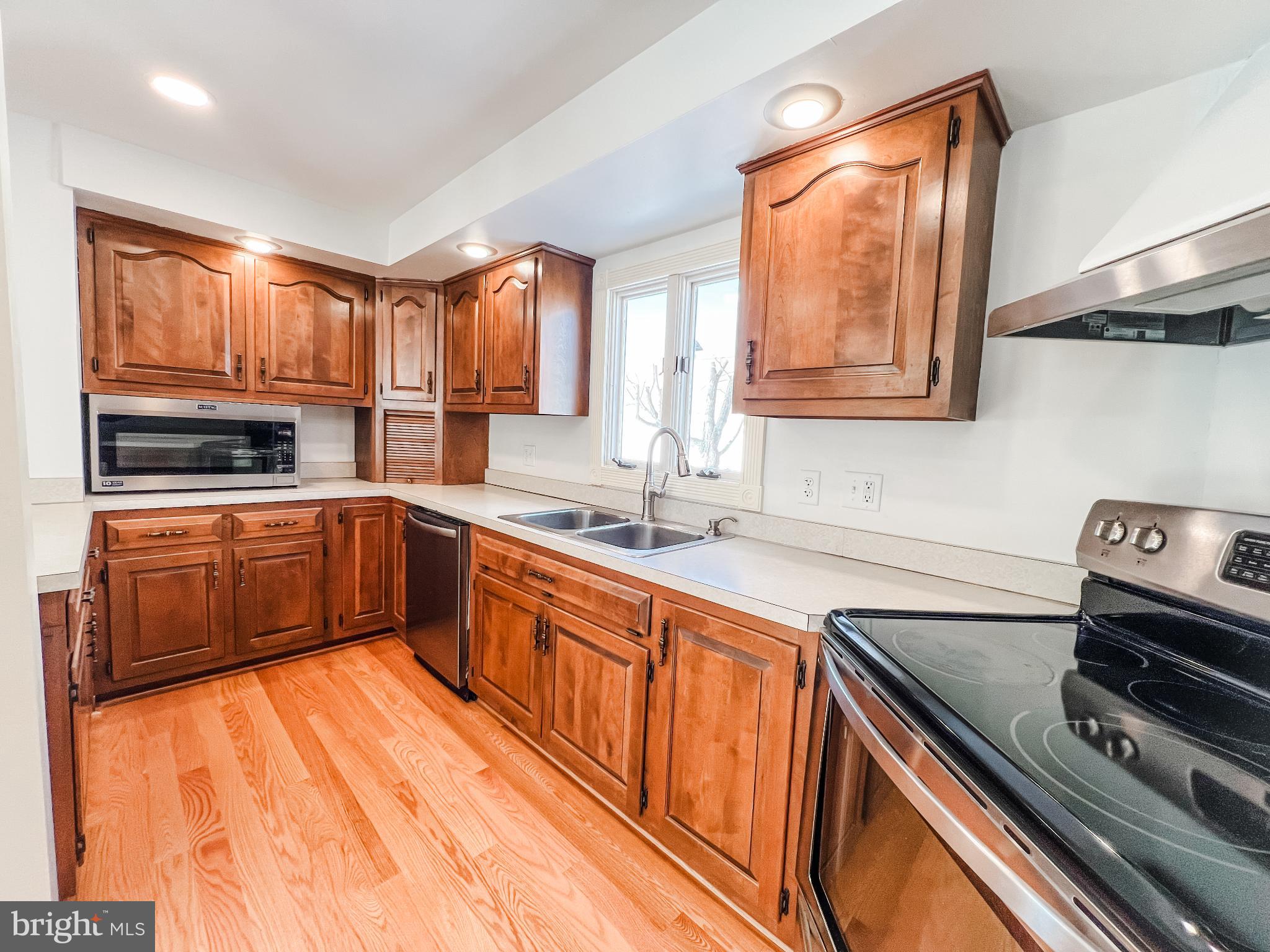 126 South Orange Street Beavertown, PA 17813 - Photo 5 of 25 a kitchen with stainless steel appliances kitchen island granite countertop a stove sink and cabinets