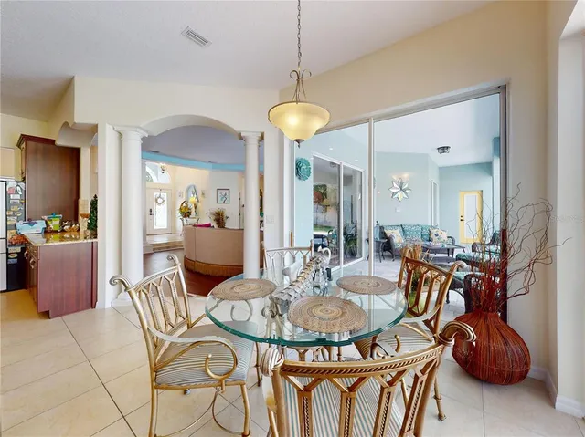 a kitchen with stainless steel appliances granite countertop a refrigerator and a stove