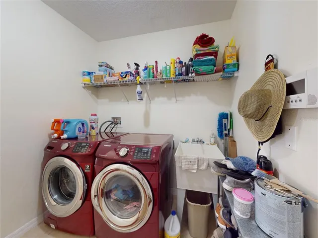 a bathroom with a sink a mirror and shower