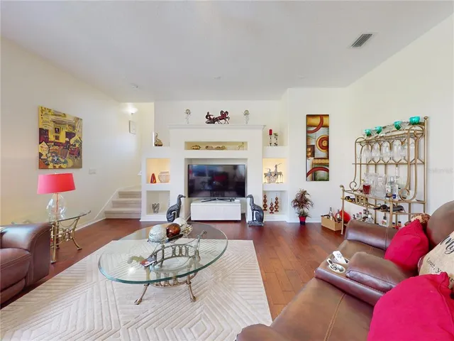 a spacious bathroom with a granite countertop sink and a mirror