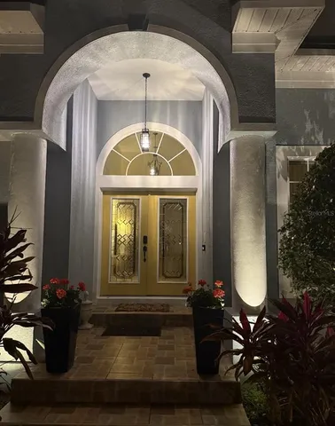 a living room with fireplace furniture and a wooden floor