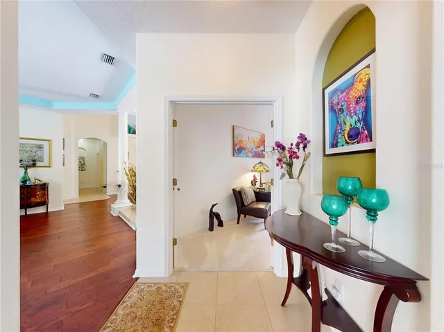 a bedroom with a bed chair and dresser