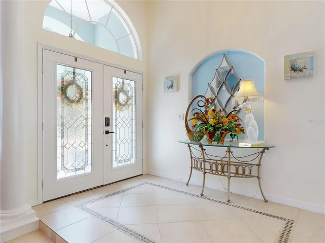 a view of a dining room with furniture wooden floor and chandelier