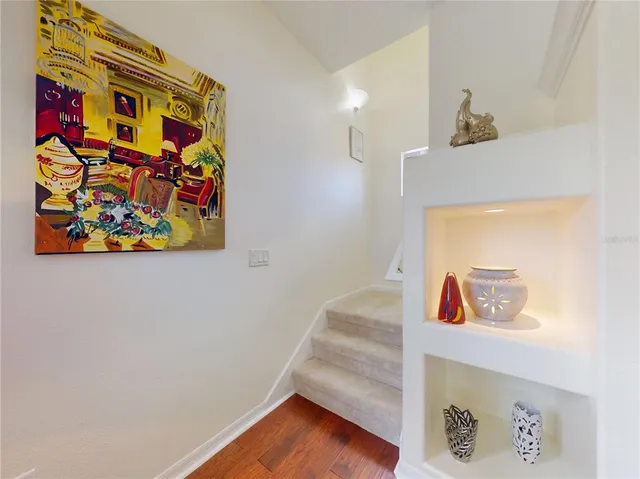 a view of a backyard with plants and a patio