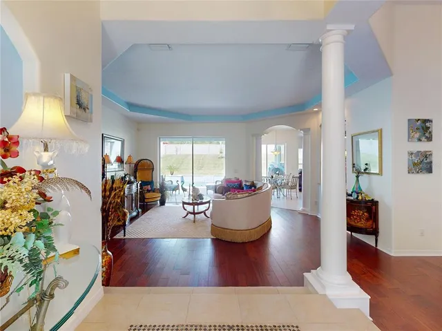 a view of a dining room with furniture and wooden floor