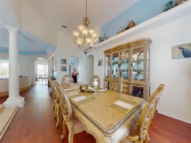 a living room with furniture and a dining table