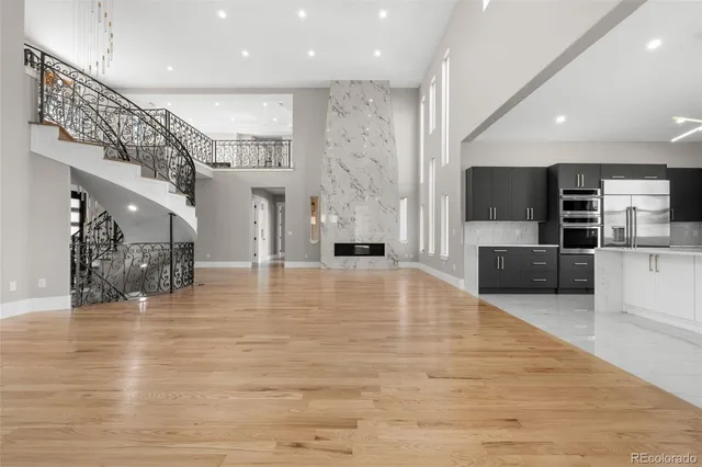 a living room with fireplace furniture and a flat screen tv