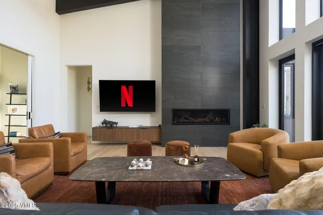 a living room with furniture a lamp and a fireplace