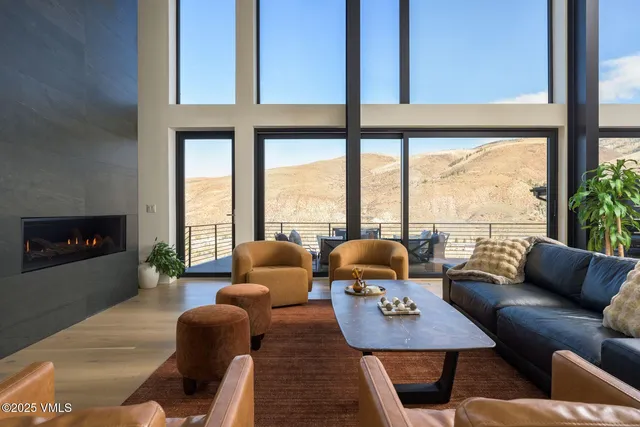 a dining room with furniture and a chandelier