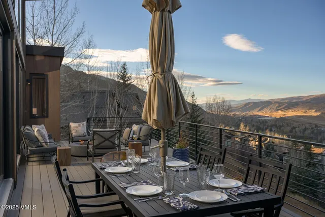a kitchen with a table chairs stove and cabinets