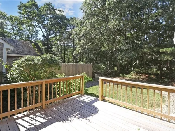 a view of balcony with wooden floor
