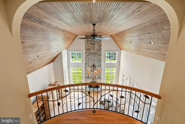 a room with pool table and windows