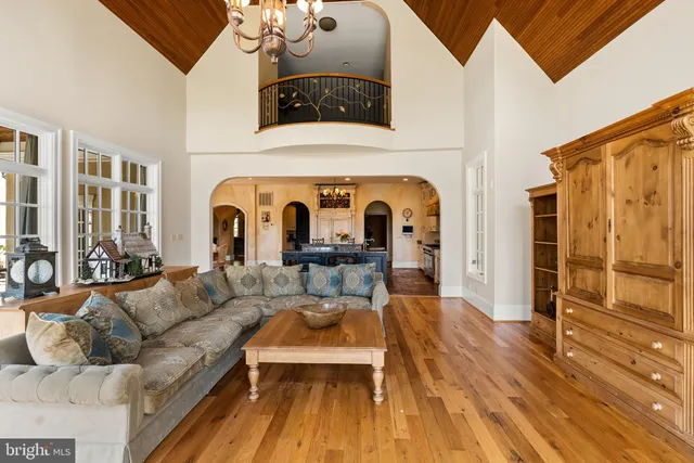 a view of a big room with windows and entryway