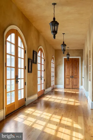 a view of an empty room with windows