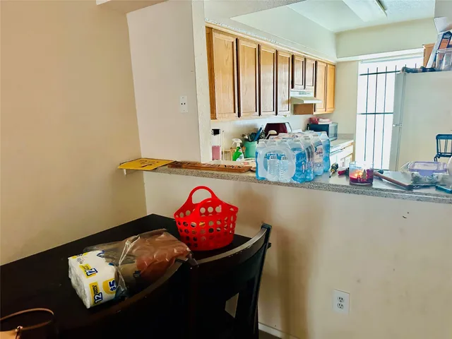 a bathroom with a sink mirror and window