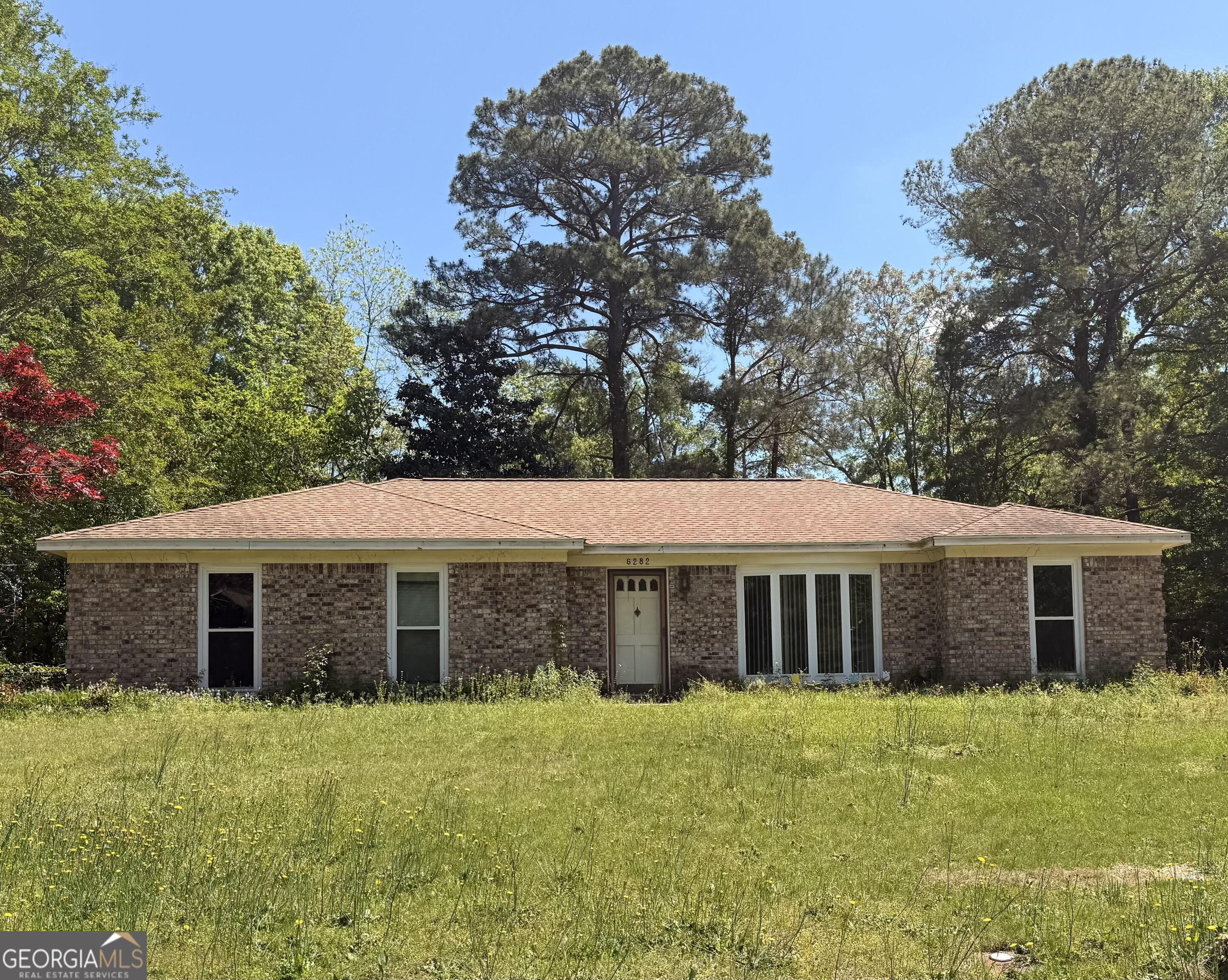 6282 Starlight Drive Columbus, GA 31909 - Photo 1 of 19 a front view of a house with a garden
