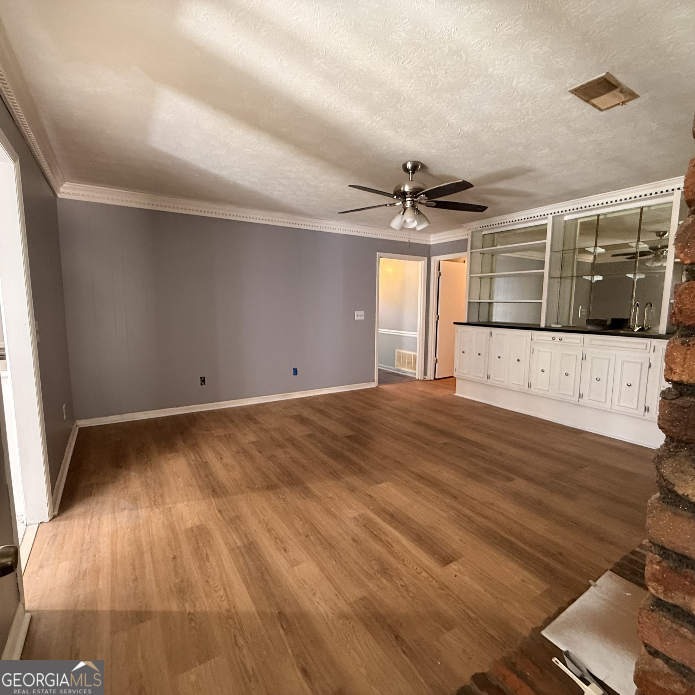 6282 Starlight Drive Columbus, GA 31909 - Photo 12 of 19 an empty room with wooden floor and windows