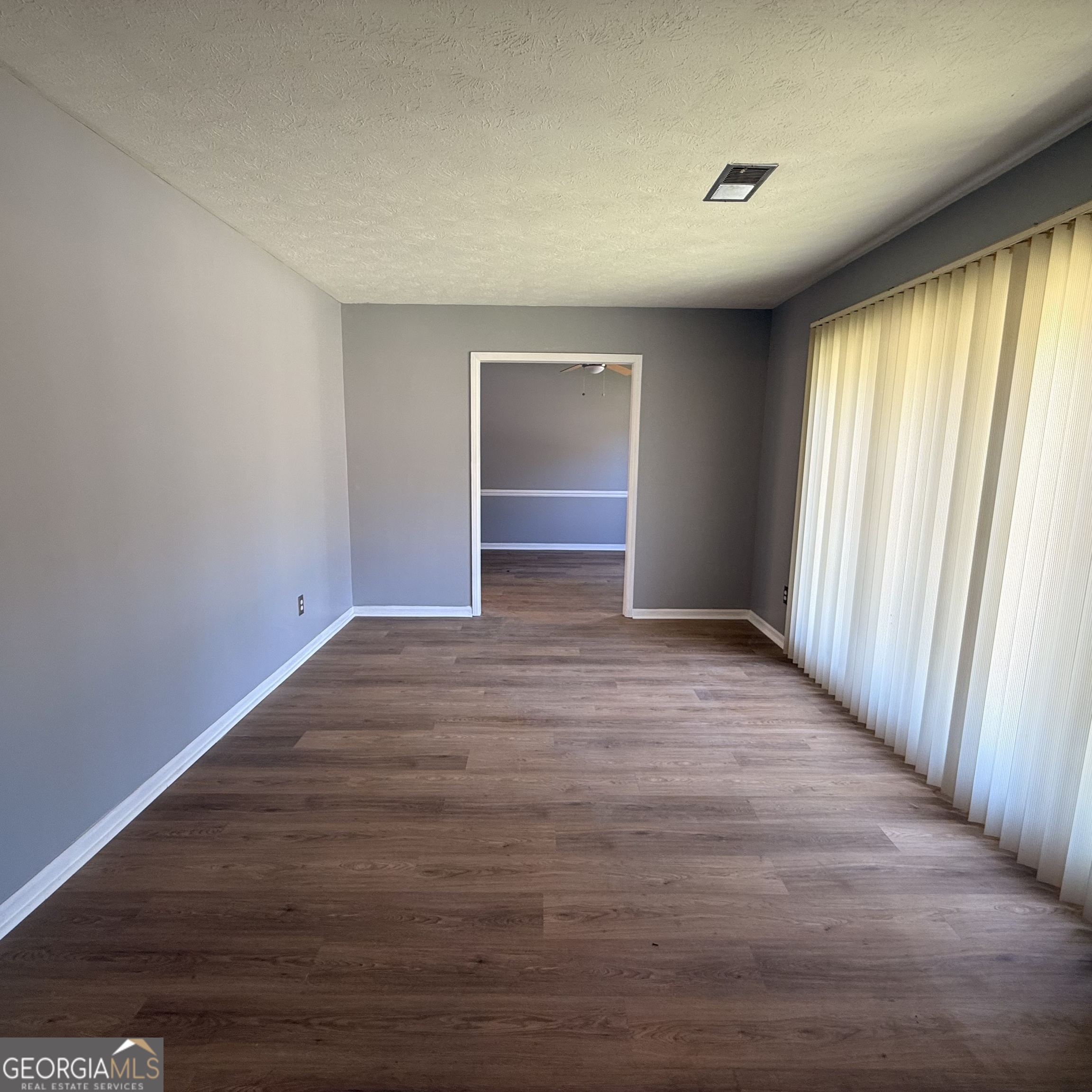 6282 Starlight Drive Columbus, GA 31909 - Photo 16 of 19 wooden floor in an empty room with a window