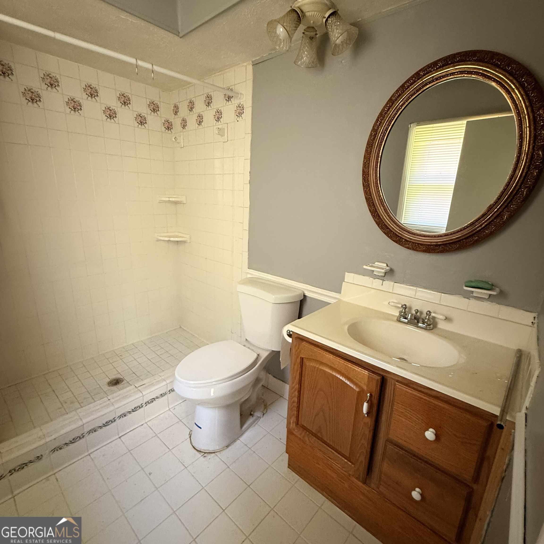 6282 Starlight Drive Columbus, GA 31909 - Photo 18 of 19 a bathroom with a sink toilet and a mirror