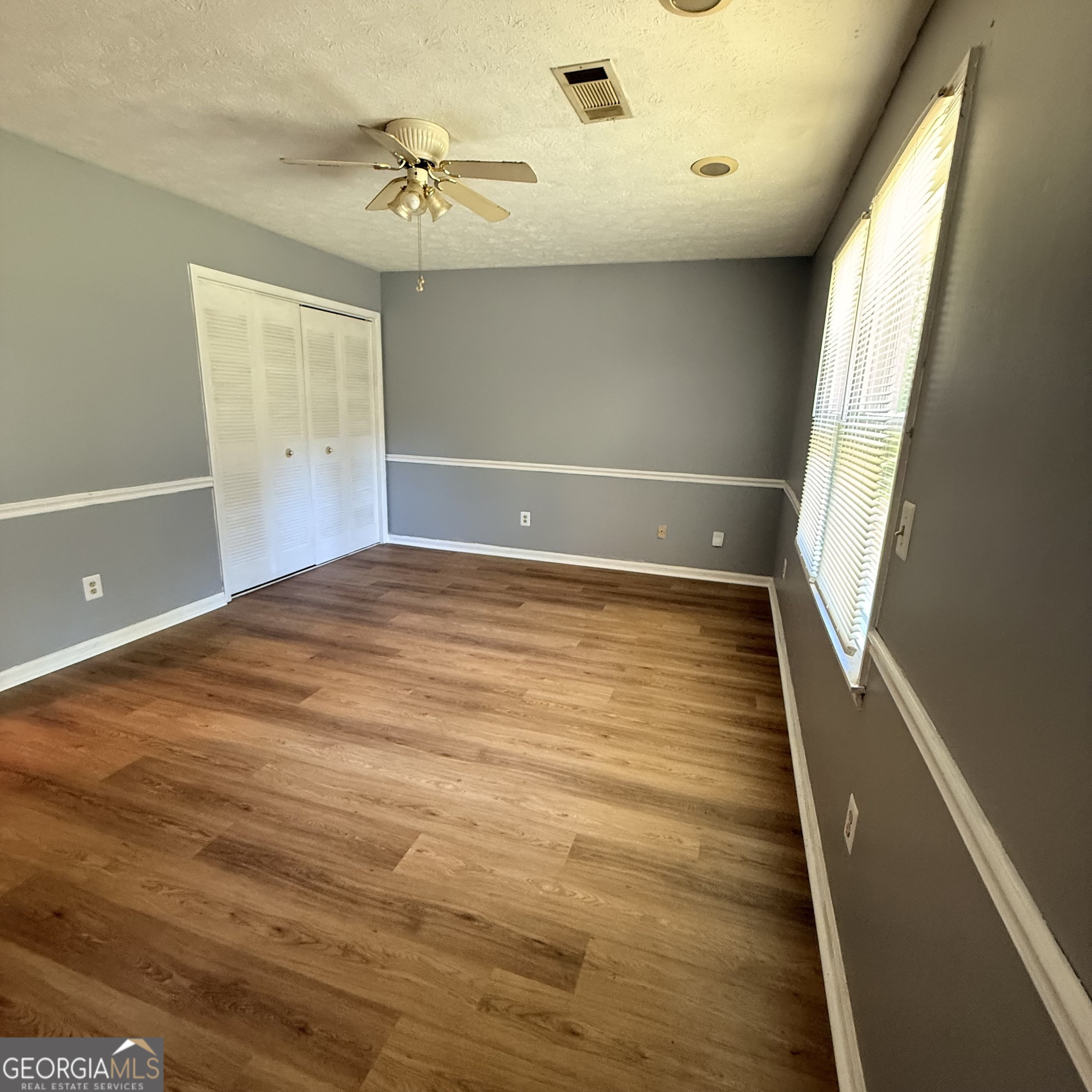 6282 Starlight Drive Columbus, GA 31909 - Photo 19 of 19 wooden floor in an empty room with a window