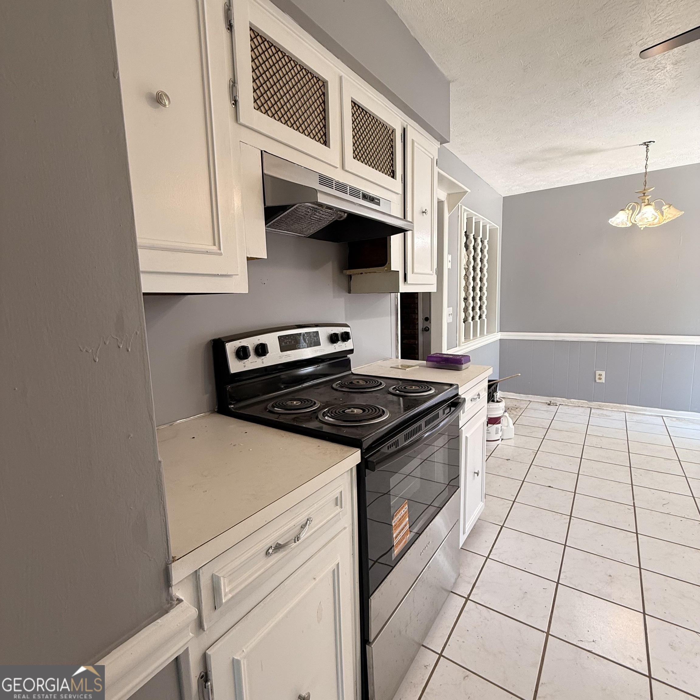 6282 Starlight Drive Columbus, GA 31909 - Photo 5 of 19 a kitchen with stainless steel appliances granite countertop a stove and a microwave