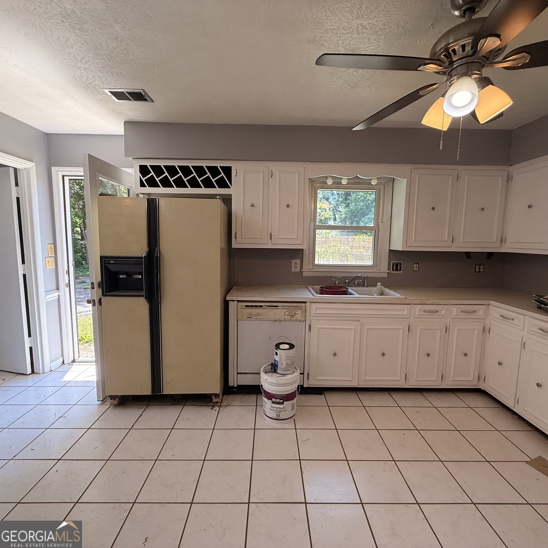 6282 Starlight Drive Columbus, GA 31909 - Photo 7 of 19 a kitchen with a refrigerator a stove a microwave and cabinets
