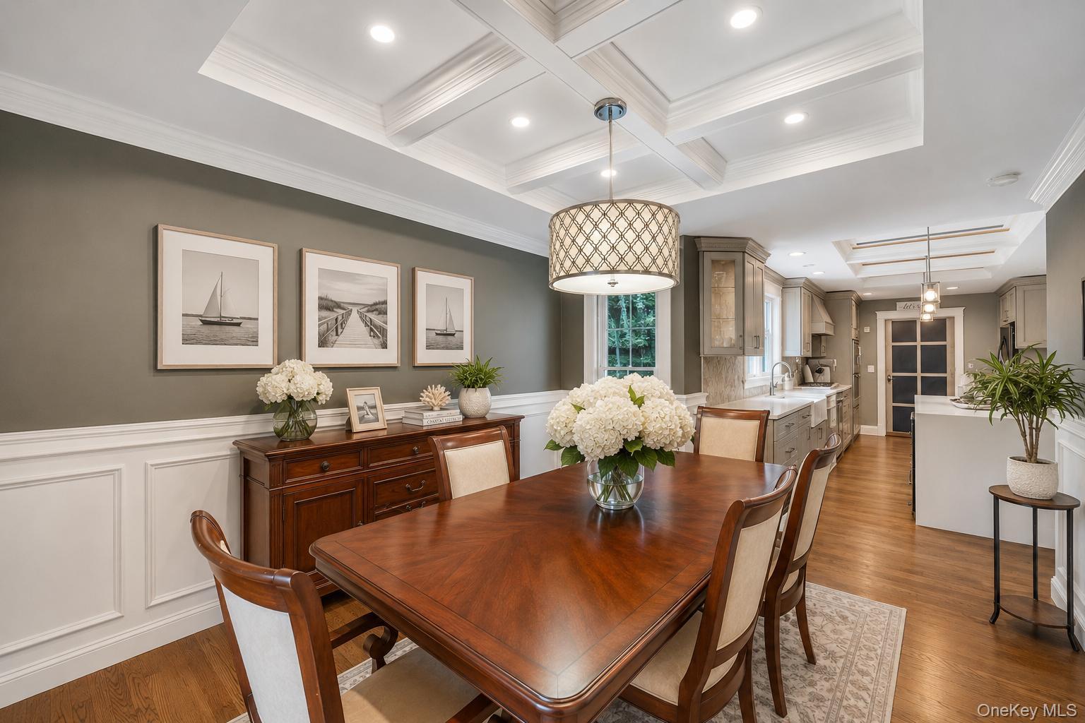 19 Joan Road Bay Shore, NY 11706 - Photo 16 of 50 Dining area featuring coffered ceilings with recessed lighting, wood-finish flooring, and wainscoting