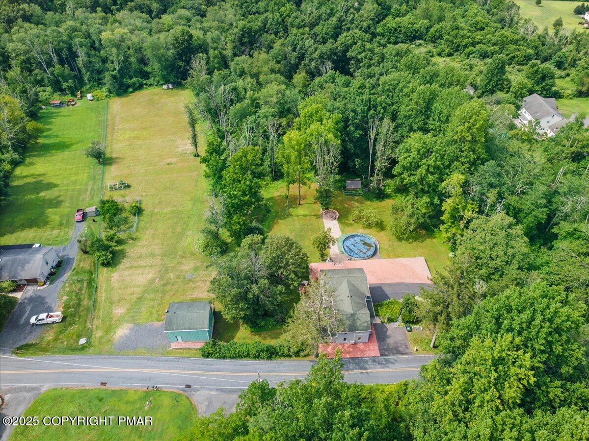 1553 Middle Road Stroudsburg, PA 18360 - Photo 16 of 75 an aerial view of a house with a garden and yard