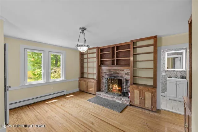 a view of livingroom with hardwood floor and hallway