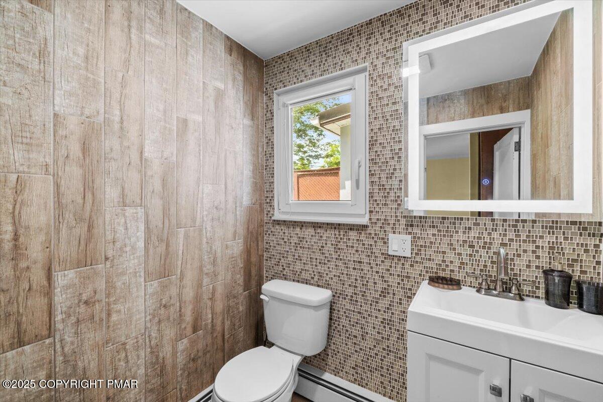 1553 Middle Road Stroudsburg, PA 18360 - Photo 26 of 75 a bathroom with a toilet a sink and a window