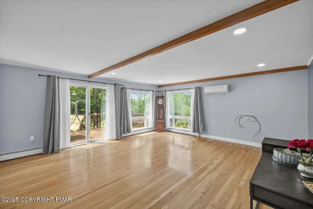 a spacious bedroom with a bed and a window