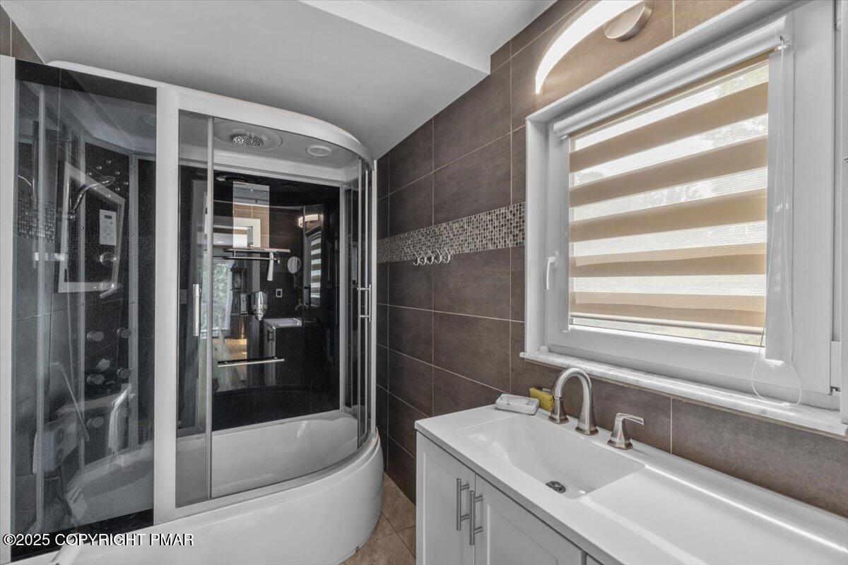 1553 Middle Road Stroudsburg, PA 18360 - Photo 33 of 75 a white bath tub sitting next to a white sink