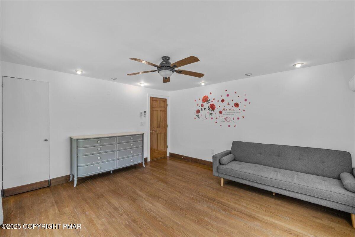 1553 Middle Road Stroudsburg, PA 18360 - Photo 35 of 75 a living room with furniture and a ceiling fan