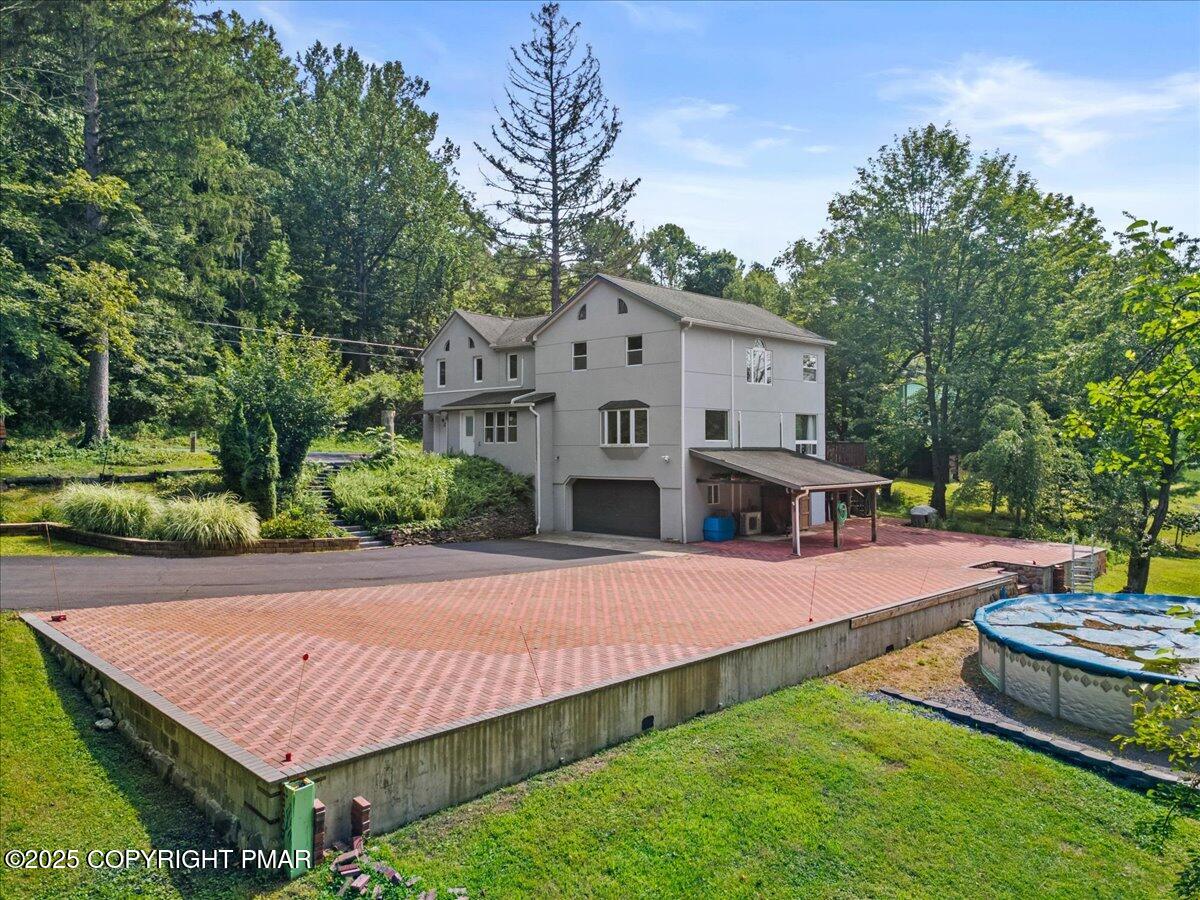 1553 Middle Road Stroudsburg, PA 18360 - Photo 4 of 75 a view of a house with pool and a yard
