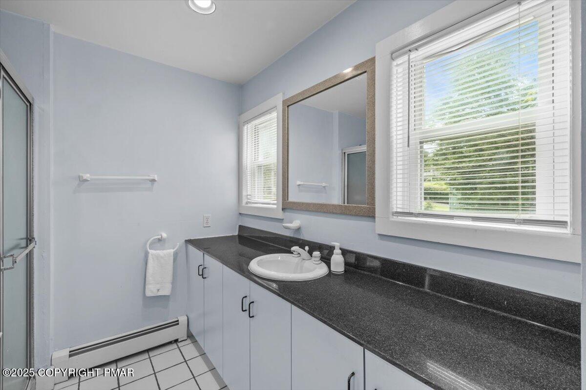 1553 Middle Road Stroudsburg, PA 18360 - Photo 47 of 75 a bathroom with a sink a vanity and a window