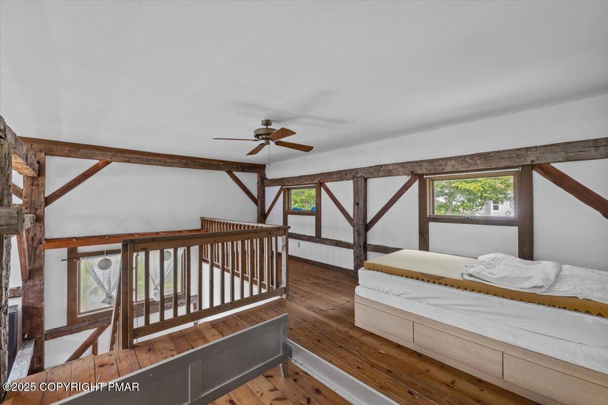 1553 Middle Road Stroudsburg, PA 18360 - Photo 63 of 75 a bedroom with a bed and a large window