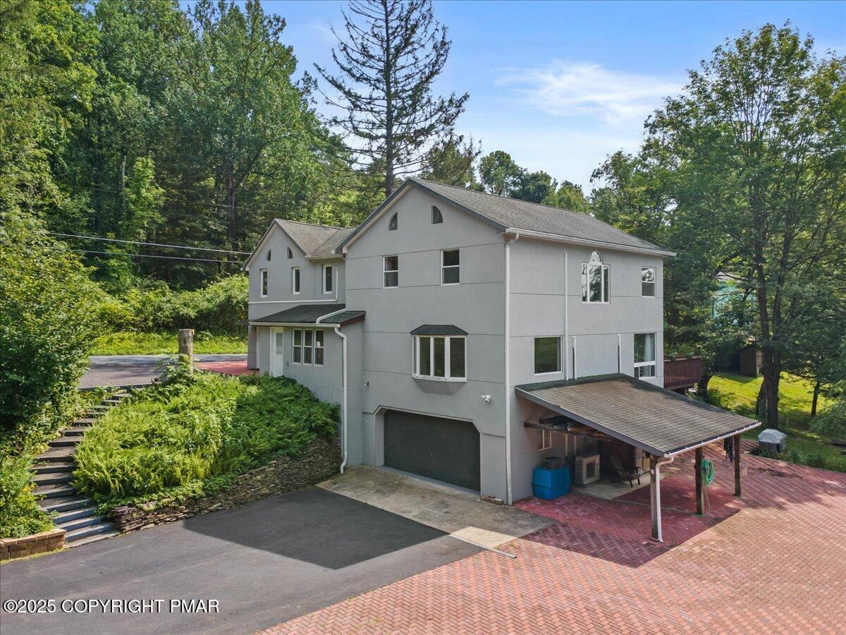 1553 Middle Road Stroudsburg, PA 18360 - Photo 65 of 75 a view of a house with a patio and a yard