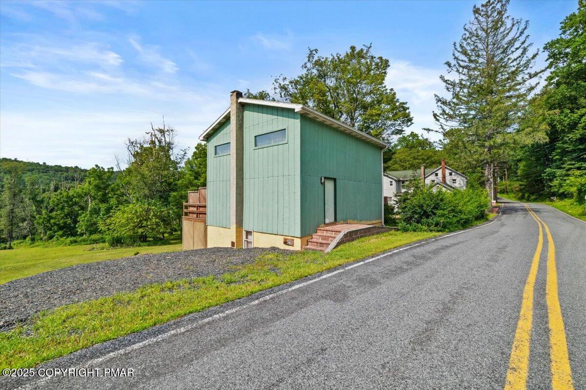 1553 Middle Road Stroudsburg, PA 18360 - Photo 70 of 75 a view of a house with a yard and a garage