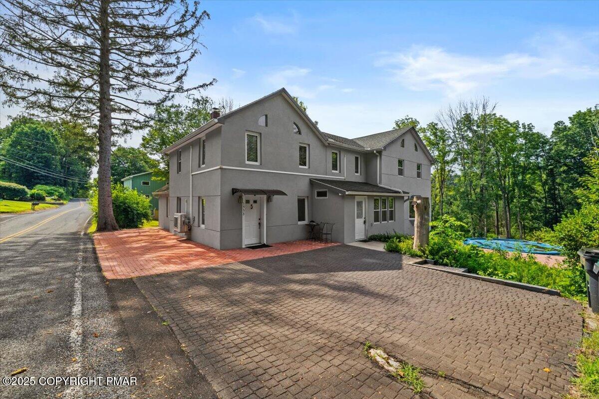 1553 Middle Road Stroudsburg, PA 18360 - Photo 74 of 75 a front view of a house with a yard and garage
