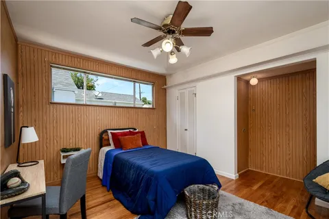 a bedroom with furniture and a window