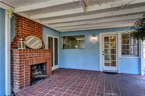 a front view of a house with a large window
