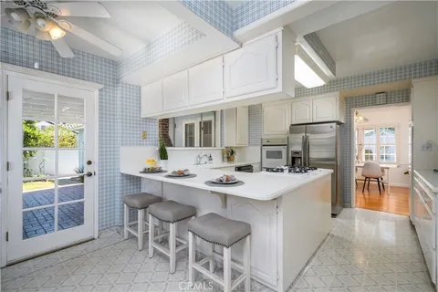 a kitchen with a sink and refrigerator