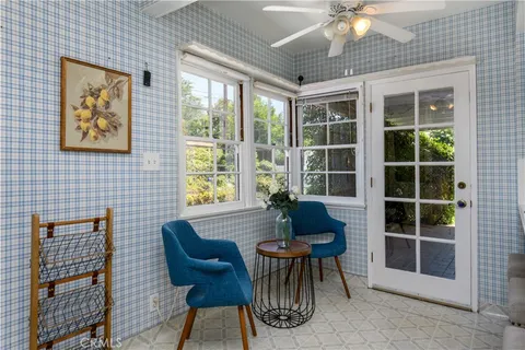 a dining room with furniture and window
